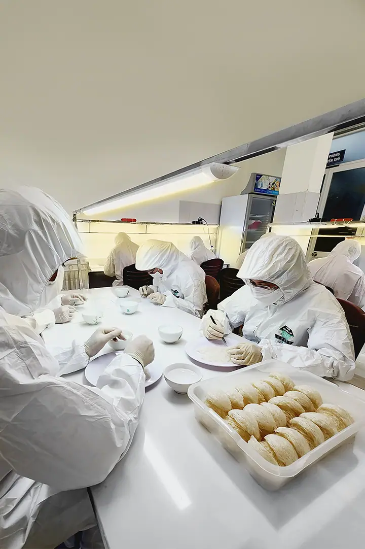 NestGia cleanroom with staff cleaning nests
